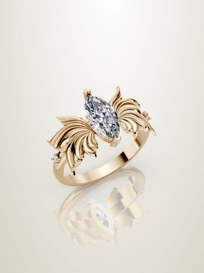 Butterfly inspired marquise diamond engagement ring in yellow gold